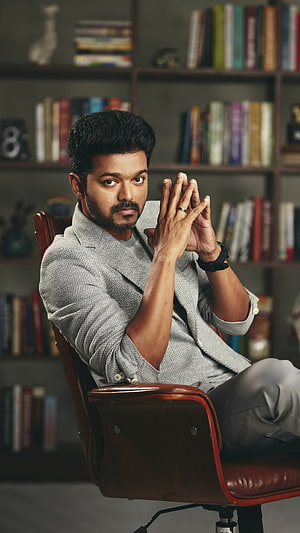 Vijay Tamil Actor Portrait in Grey Herringbone Blazer Seated in Leather Chair HD phone wallpaper