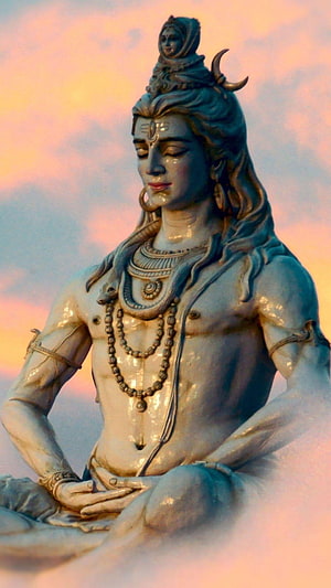Serene Statue of Lord Shiva Meditating with Crescent Moon and Snake Adornments HD phone wallpaper
