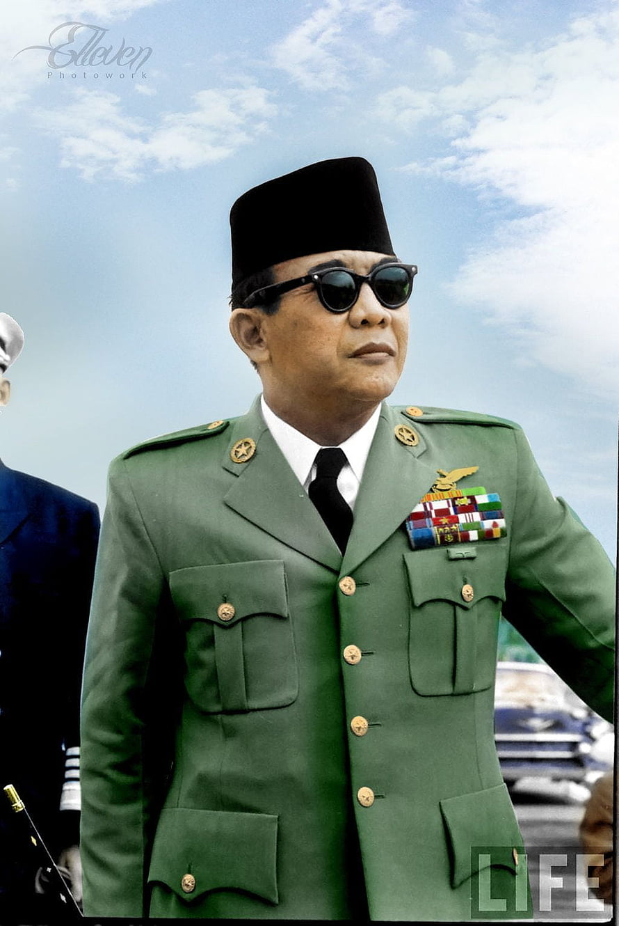 Soekarno in formal military uniform with medals and black cap against a blue sky HD phone wallpaper