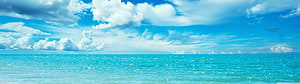 Serene Turquoise Ocean Horizon Under Bright Blue Sky With Fluffy White Clouds HD wallpaper