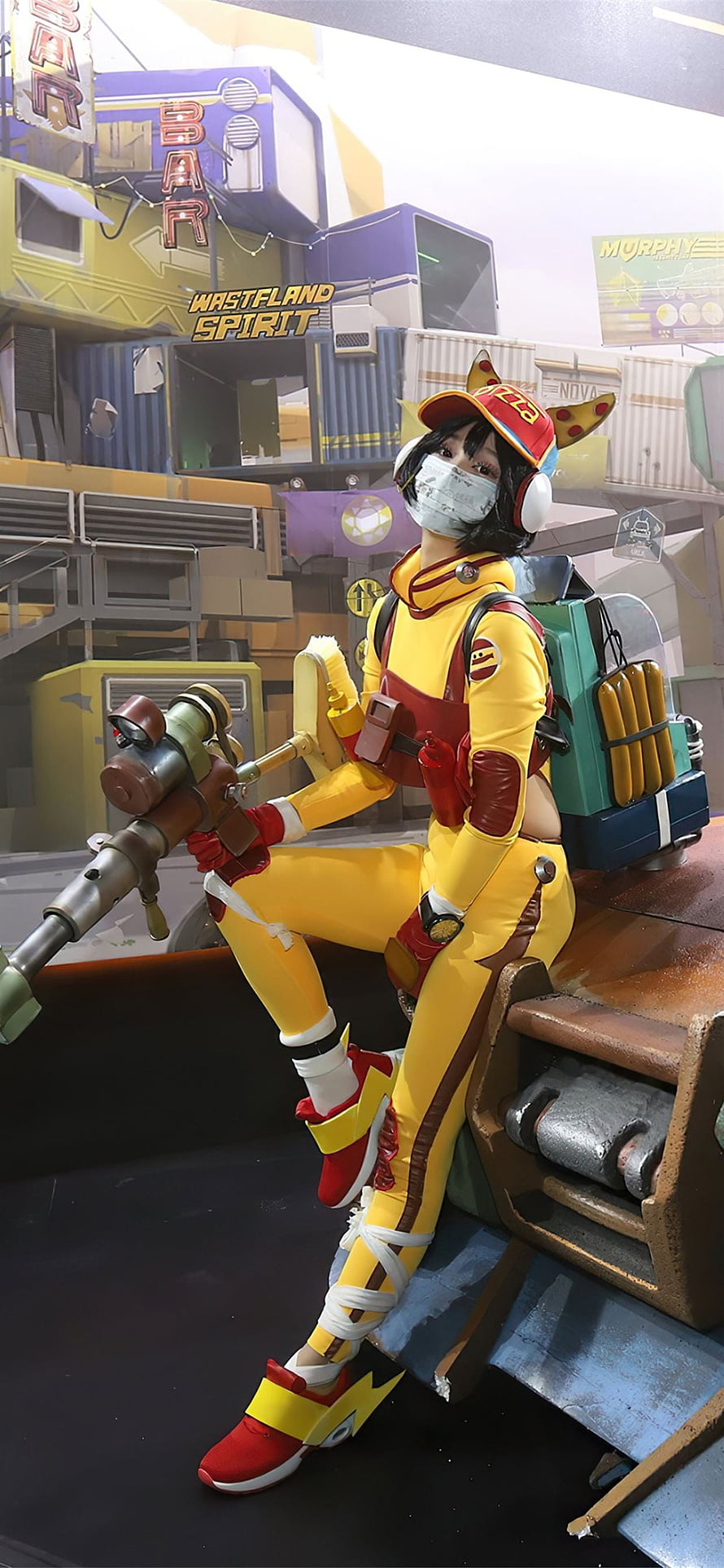 Cosplayer dressed as Dora from Wasteland Spirit in yellow jumpsuit holding weapon HD phone wallpaper