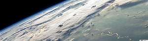 Earth Horizon From Space With Swirling Clouds And Ocean Surface HD wallpaper