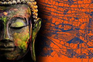 Weathered Buddha Statue Face with Vibrant Orange Cracked Texture Background HD wallpaper