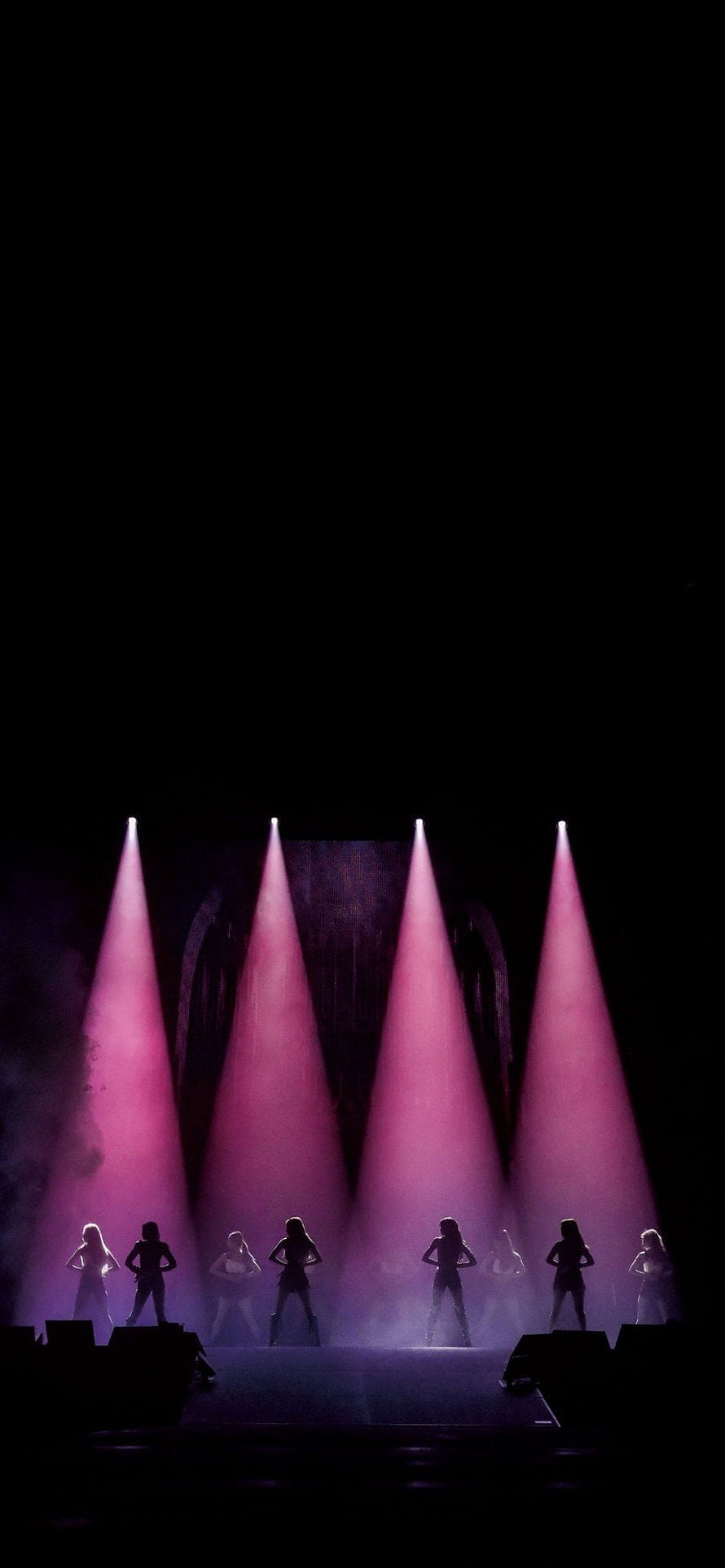 Silhouettes of female dancers performing on stage under dramatic pink spotlights HD phone wallpaper