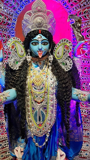 Maa Kali Durga Murti with Elaborate Jewelry and Ornate Temple Backdrop HD phone wallpaper