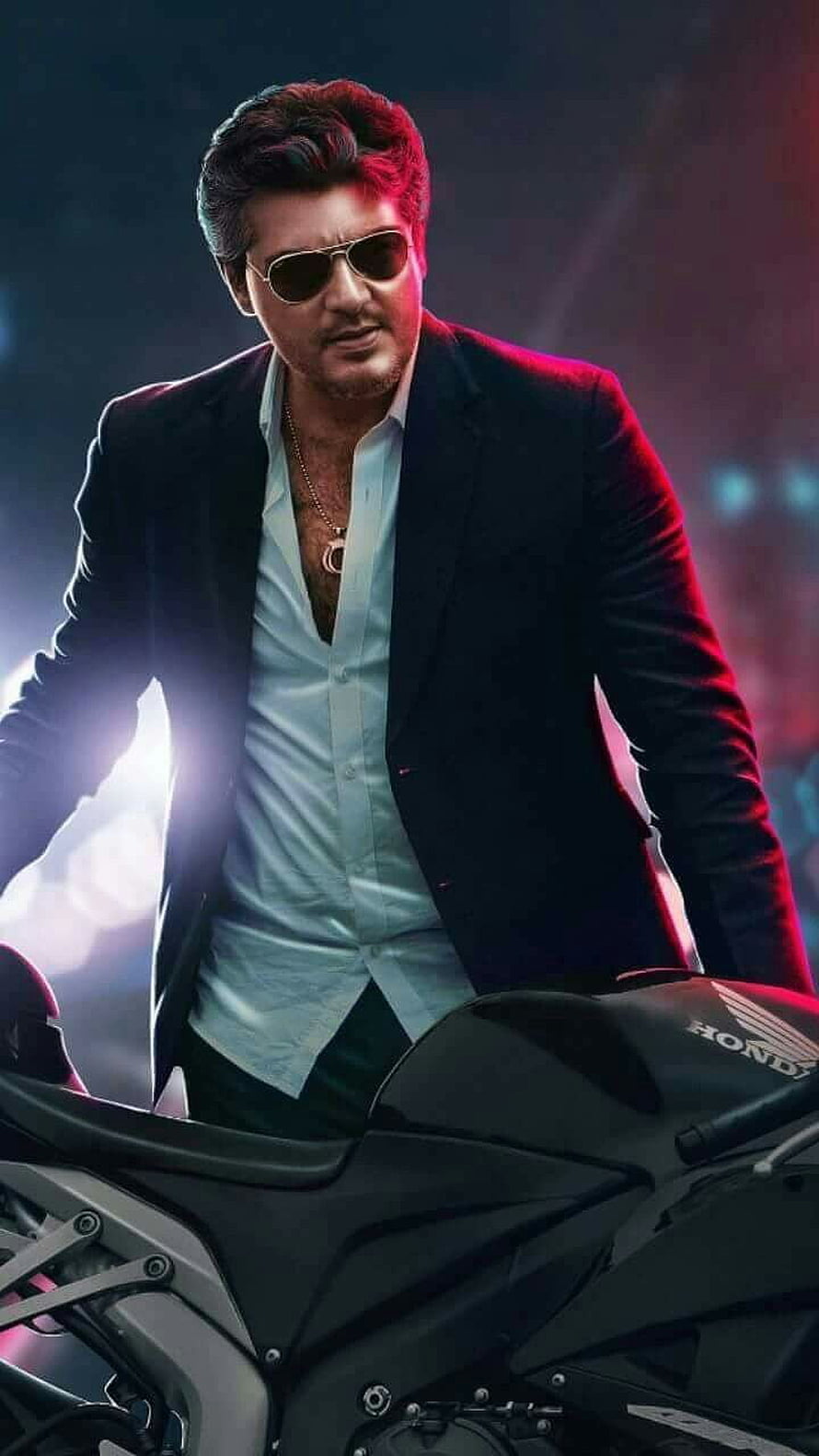 Ajith Kumar in a black suit and sunglasses standing beside a Honda motorcycle with dramatic red and blue lighting HD phone wallpaper