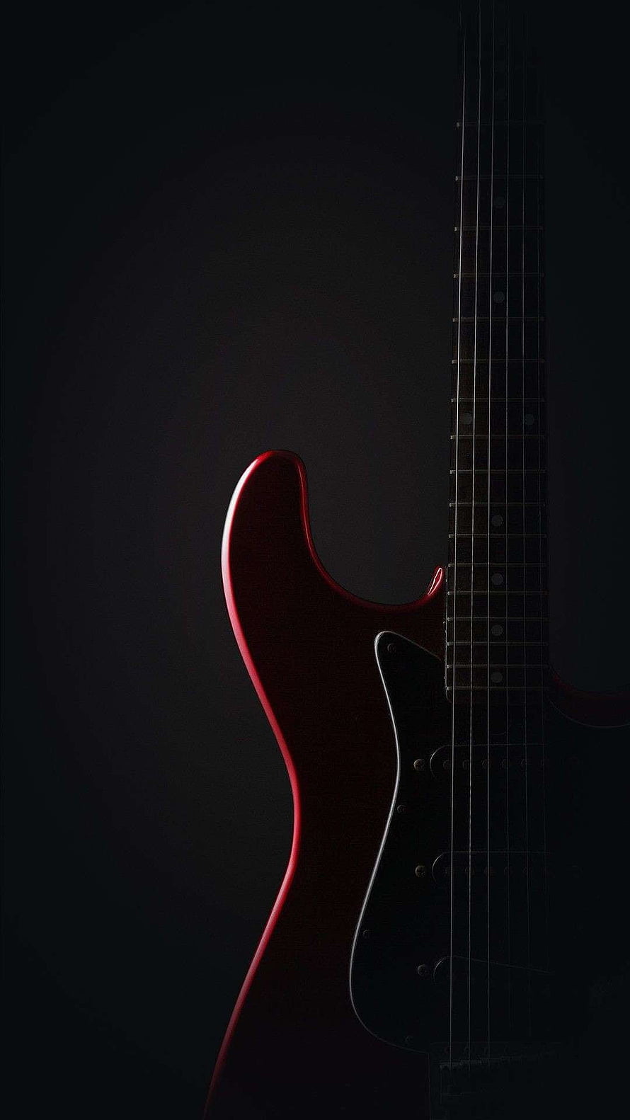 Dramatic Red Fender Electric Guitar Silhouette Against Dark Background HD phone wallpaper