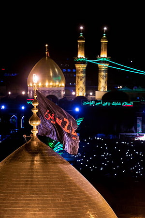 Karbala Shrine at Night with Golden Domes and Minarets Illuminated HD phone wallpaper