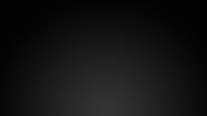 Minimalist Dark Gradient Background with Subtle Vignette and Soft Center Glow HD wallpaper