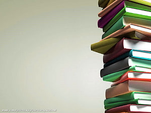 Colorful Stack of Hardcover Books Against a Neutral Beige Background HD wallpaper