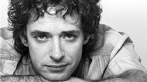 Gustavo Cerati Black and White Portrait with Curly Hair and Intense Gaze HD wallpaper