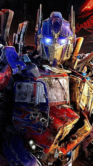 Battle-Worn Optimus Prime Close-Up with Glowing Blue Eyes and Rusted Armor HD phone wallpaper