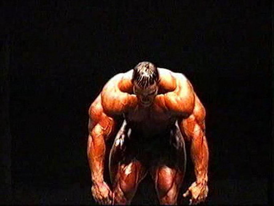 Kevin Levrone Bodybuilder Intense Muscle Pose in Dramatic Dark Lighting HD wallpaper