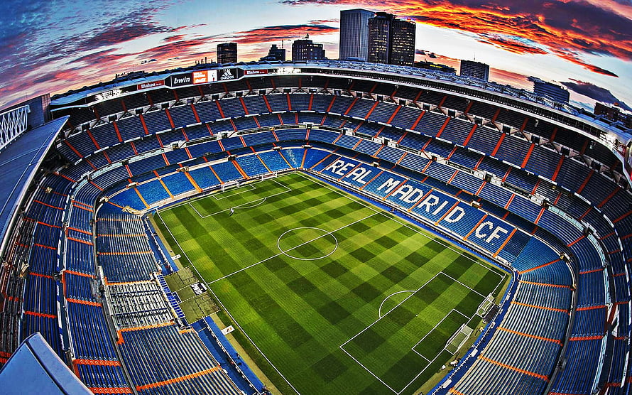 Santiago Bernabeu Stadium Interior at Sunset with Real Madrid CF Seating HD wallpaper