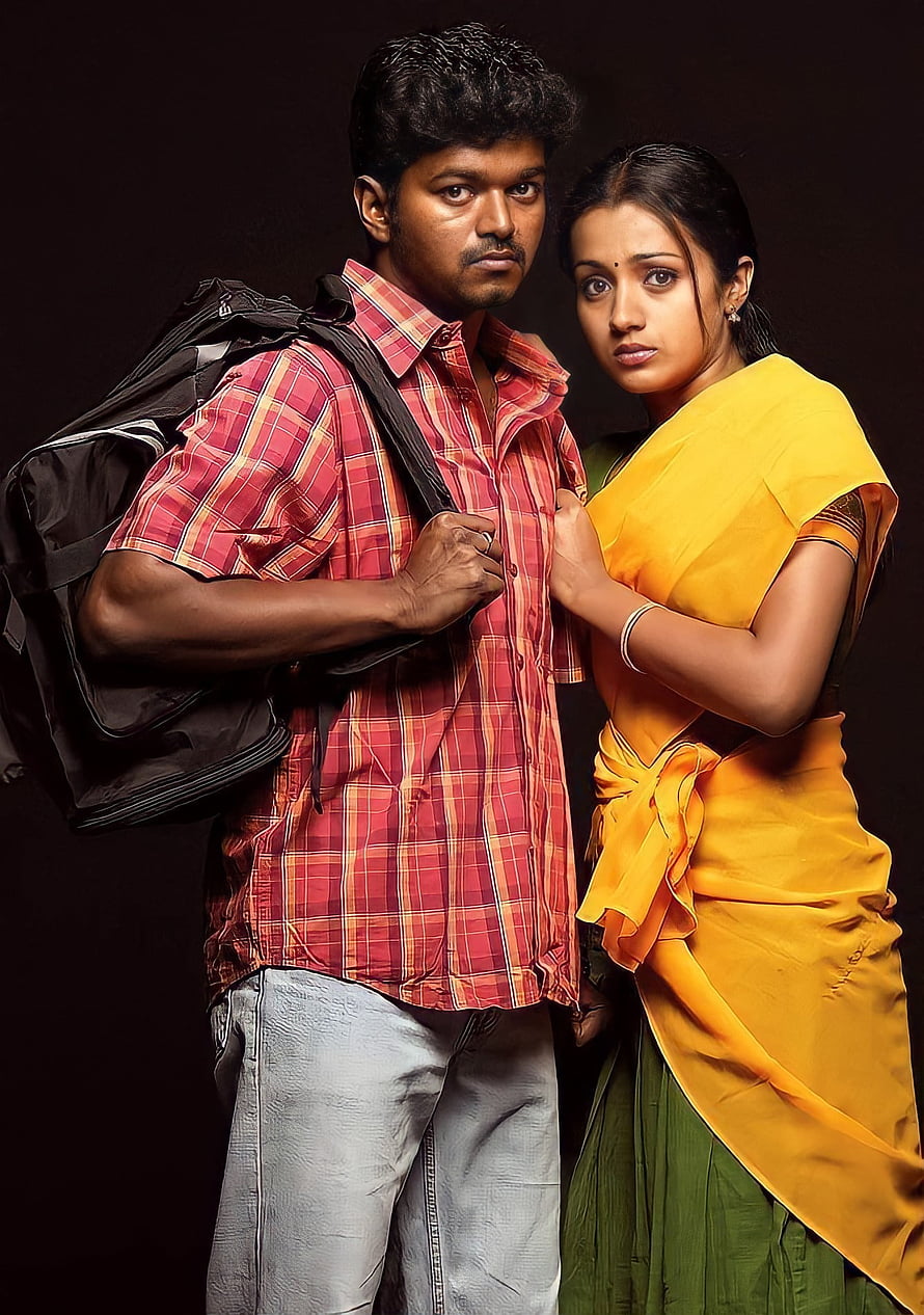 Vijay and Trisha in a dramatic studio portrait from the Tamil film Ghilli HD phone wallpaper