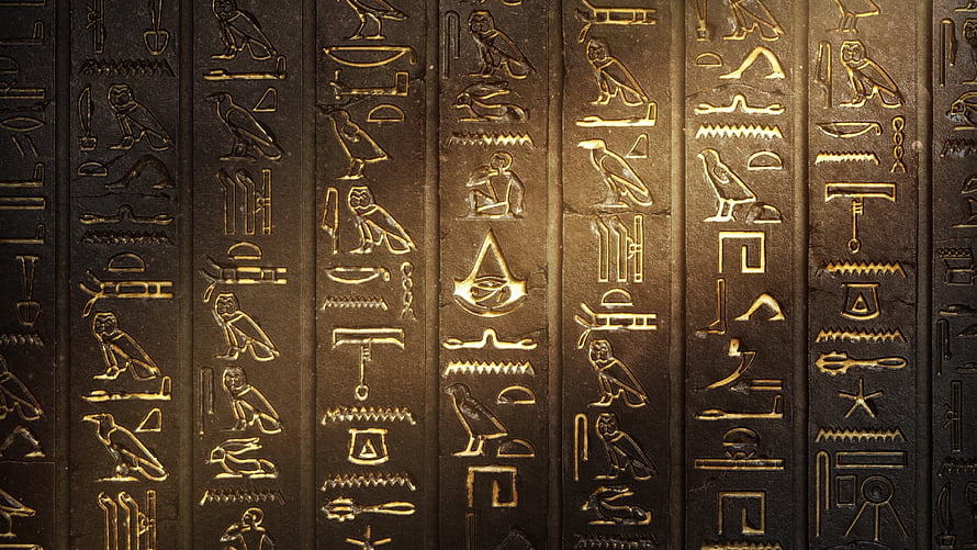 Ancient Egyptian Hieroglyphs Carved on Dark Stone Wall with Golden Accents HD wallpaper