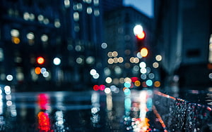 Moody Urban Night Scene with Bokeh City Lights and Wet Street Reflections HD wallpaper
