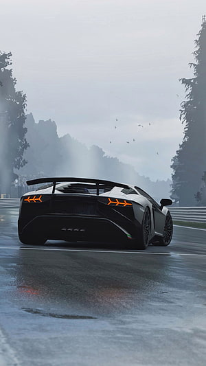 Lamborghini Aventador SVJ on a wet racetrack in foggy weather HD phone wallpaper