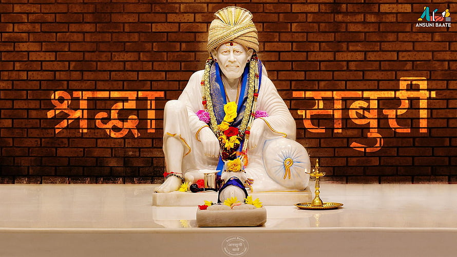 Sai Baba Statue Seated in White Robes with Flower Garland and Oil Lamp on Brick Background HD wallpaper