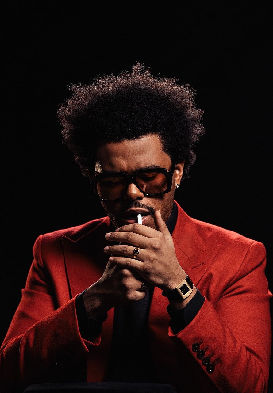 The Weeknd in a red suit and sunglasses smoking a cigarette against a black background HD phone wallpaper