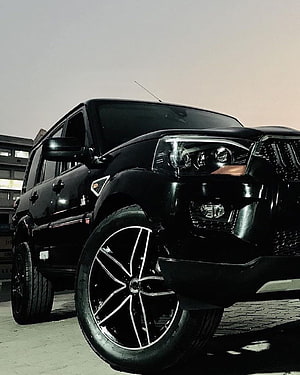 Sleek Black Mahindra Scorpio SUV with Custom Alloy Wheels HD phone wallpaper