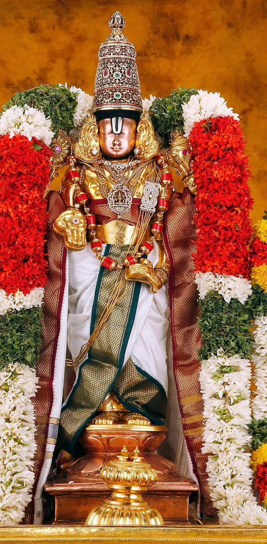 Golden Statue of Lord Ayyappa Adorned with Jewels and Flower Garlands HD phone wallpaper