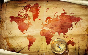 Vintage World Map with Brass Compass on Aged Parchment Paper HD wallpaper