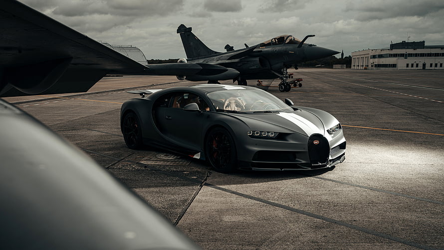 Matte Gray Bugatti Chiron Super Sport with White Stripes Parked on Airfield Tarmac HD wallpaper