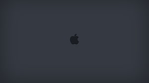 Minimalist Apple Logo on Dark Gray Background for Mac and MacBook Desktop HD wallpaper