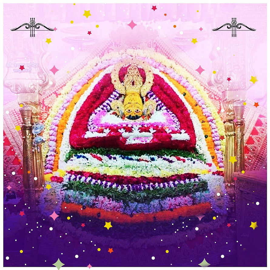 Colorful Hindu Temple Deity Statue Adorned With Vibrant Flower Garlands And Festive Decorations HD phone wallpaper