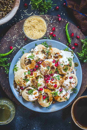 Dahi Puri with Yogurt, Pomegranate, and Spices on a Rustic Wooden Board HD phone wallpaper