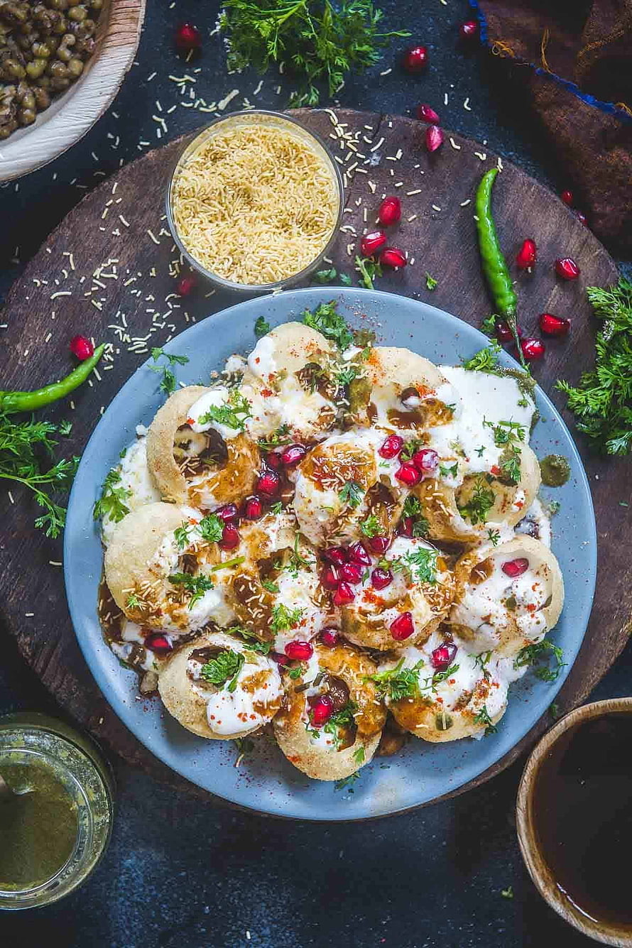 Dahi Puri with Yogurt, Pomegranate, and Spices on a Rustic Wooden Board HD phone wallpaper