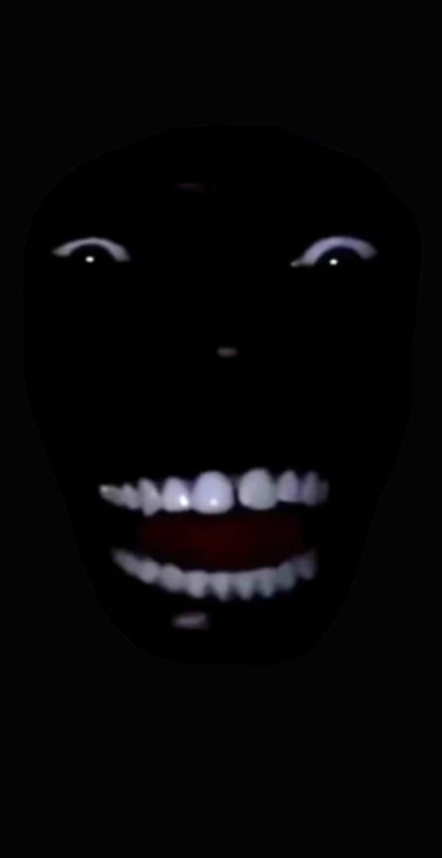 Eerie Black Face With Glowing White Teeth And Eyes In Darkness HD phone wallpaper