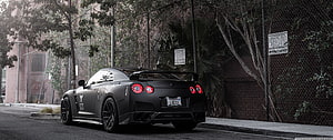 Matte Black Nissan GT-R R35 Rear View Parked on Urban Street HD wallpaper
