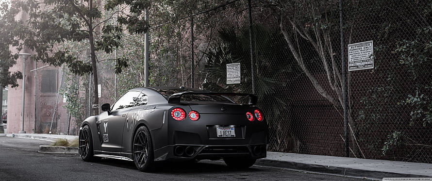 Matte Black Nissan GT-R R35 Rear View Parked on Urban Street HD wallpaper