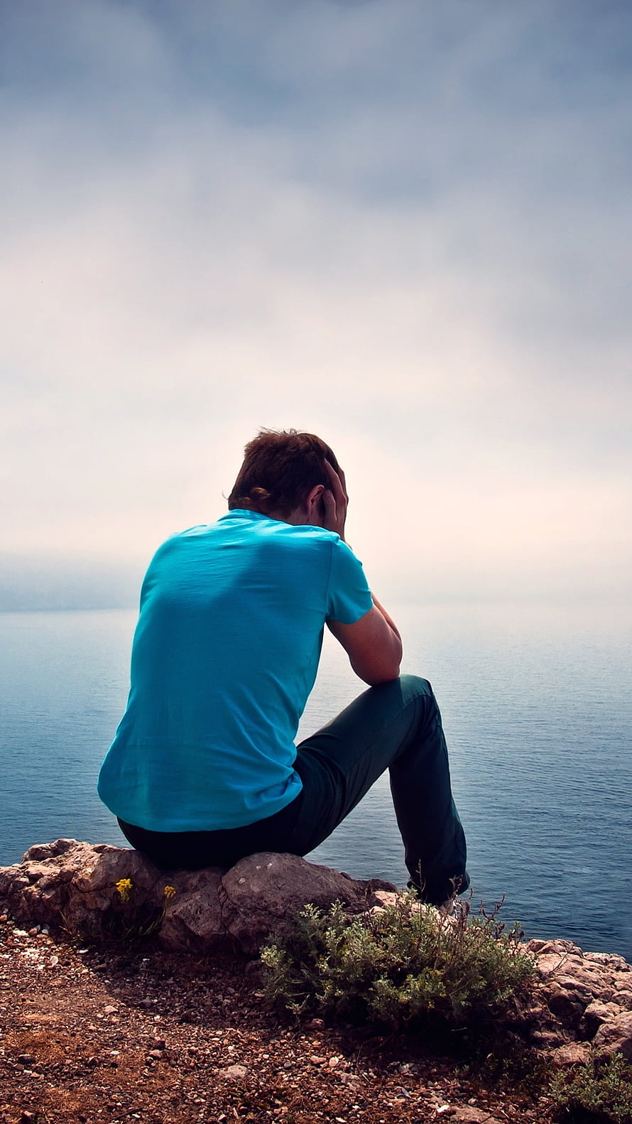 Man Sitting Alone on Rocky Cliff Overlooking the Sea in a Moment of Solitude, Single Boy Attitude, Sad, Alone HD phone wallpaper