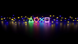 PlayStation Neon Symbols on Dark Stage with Glowing Particles and Reflective Floor HD wallpaper