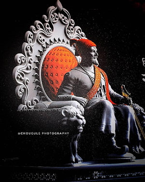 Statue of Chhatrapati Shivaji Maharaj Sitting on an Ornate Throne with Lion Motifs HD phone wallpaper