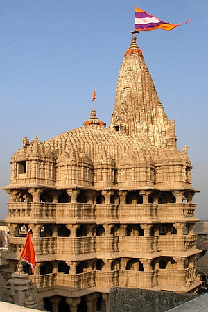 Ancient Dwarka Hindu Temple in Gujarat India with Ornate Stone Carvings and Traditional Flags HD phone wallpaper