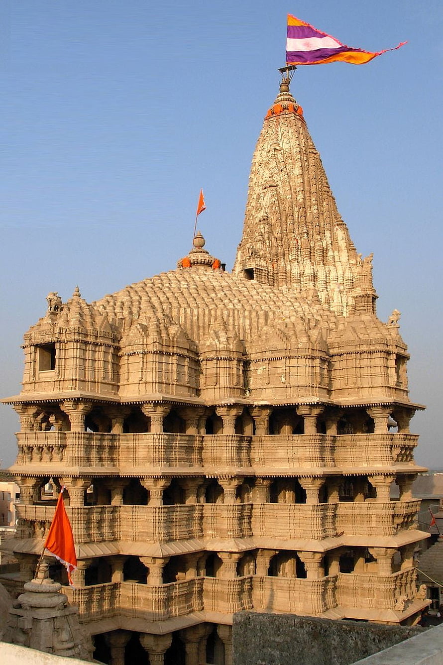 Ancient Dwarka Hindu Temple in Gujarat India with Ornate Stone Carvings and Traditional Flags HD phone wallpaper