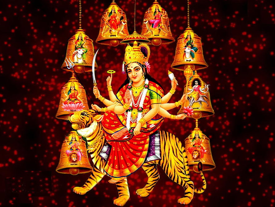 Mata Rani Durga Riding a Tiger with Hanging Bells and Diya Lamps on a Red Sparkling Background HD wallpaper