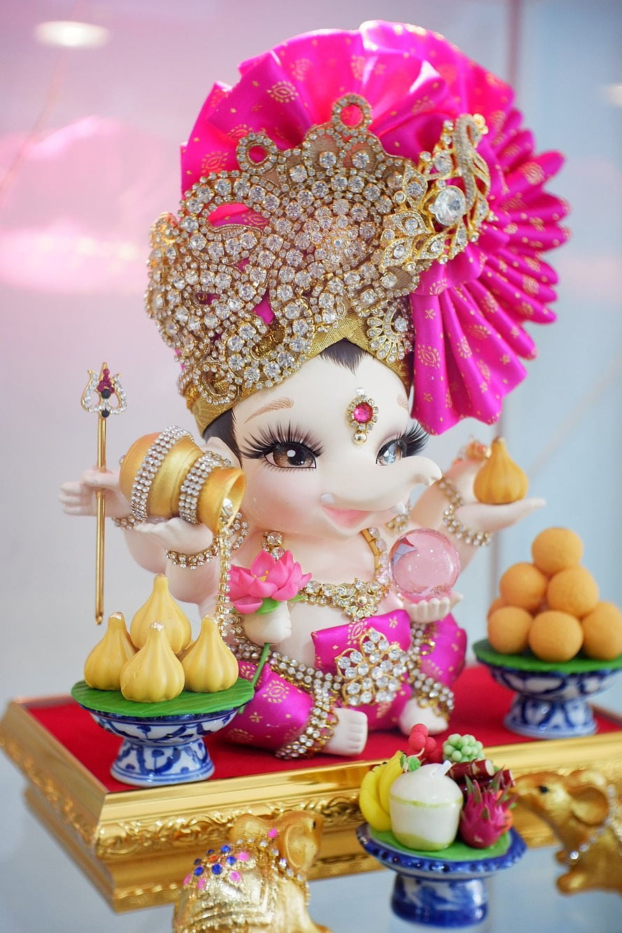 Adorable Baby Ganesha Idol with Pink Headdress and Golden Jewelry HD phone wallpaper