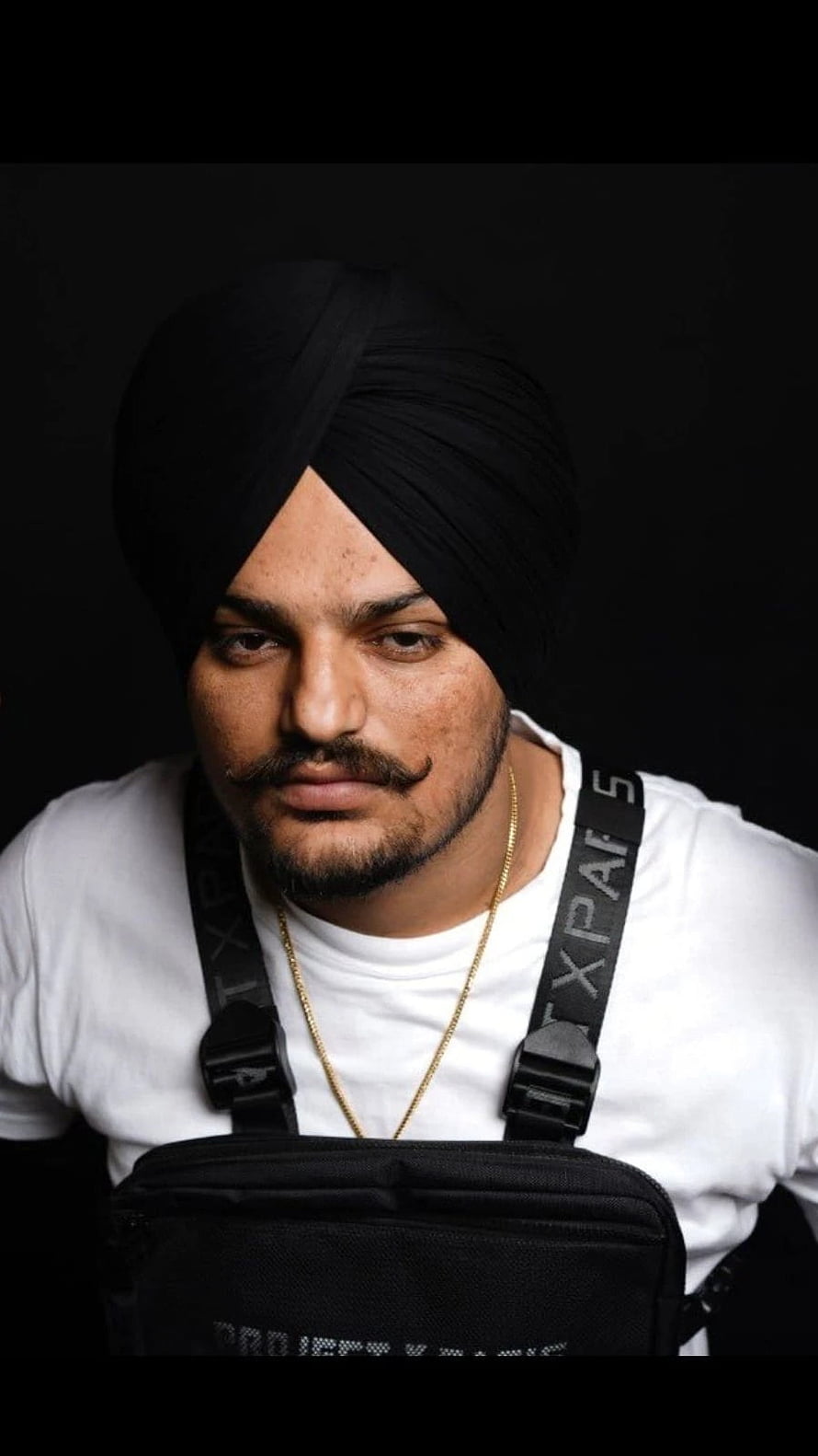 Portrait of Diljit Dosanjh Wearing a Black Turban and White T-Shirt HD phone wallpaper
