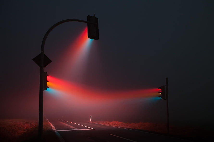 Mysterious Traffic Lights Emitting Red and Blue Beams Through Thick Fog HD wallpaper