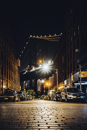 Manhattan Bridge at Night Over Cobblestone Street in New York City HD phone wallpaper