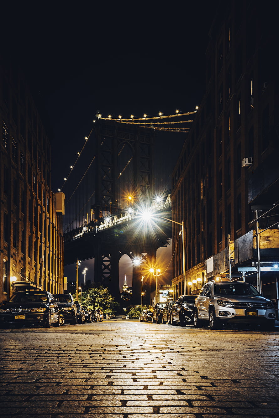 Manhattan Bridge at Night Over Cobblestone Street in New York City HD phone wallpaper