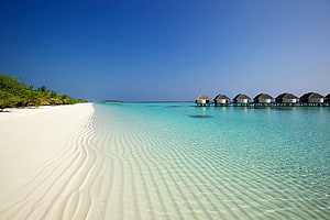 Tropical Paradise With Overwater Bungalows On White Sandy Beach HD wallpaper
