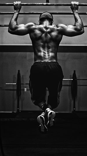Black and white photo of a muscular man performing a pull-up in a gym, Attitude, Attitude Gym Boy HD phone wallpaper