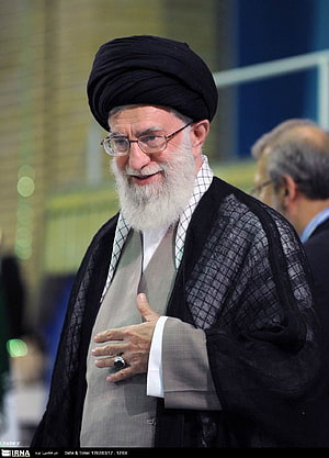 Ali Khamenei in traditional clerical attire with black turban and white beard HD phone wallpaper
