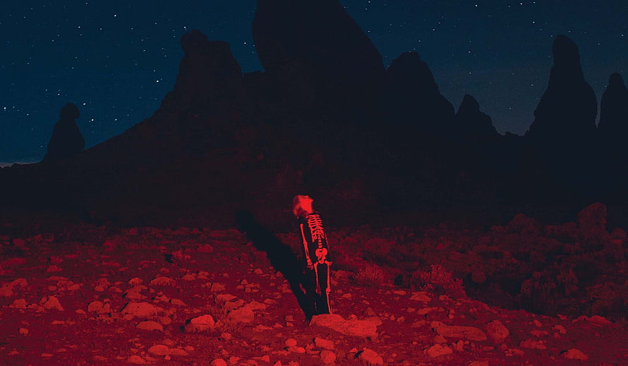 Phoebe Bridgers Punisher Album Artwork Featuring Skeleton in Red Desert Night HD wallpaper
